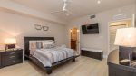 Guest bedroom with queen bed, flatscreen TV and 4-piece, ensuite bath